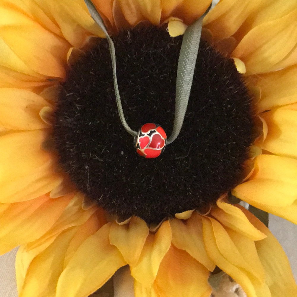 Pandora charm with red enamel hearts